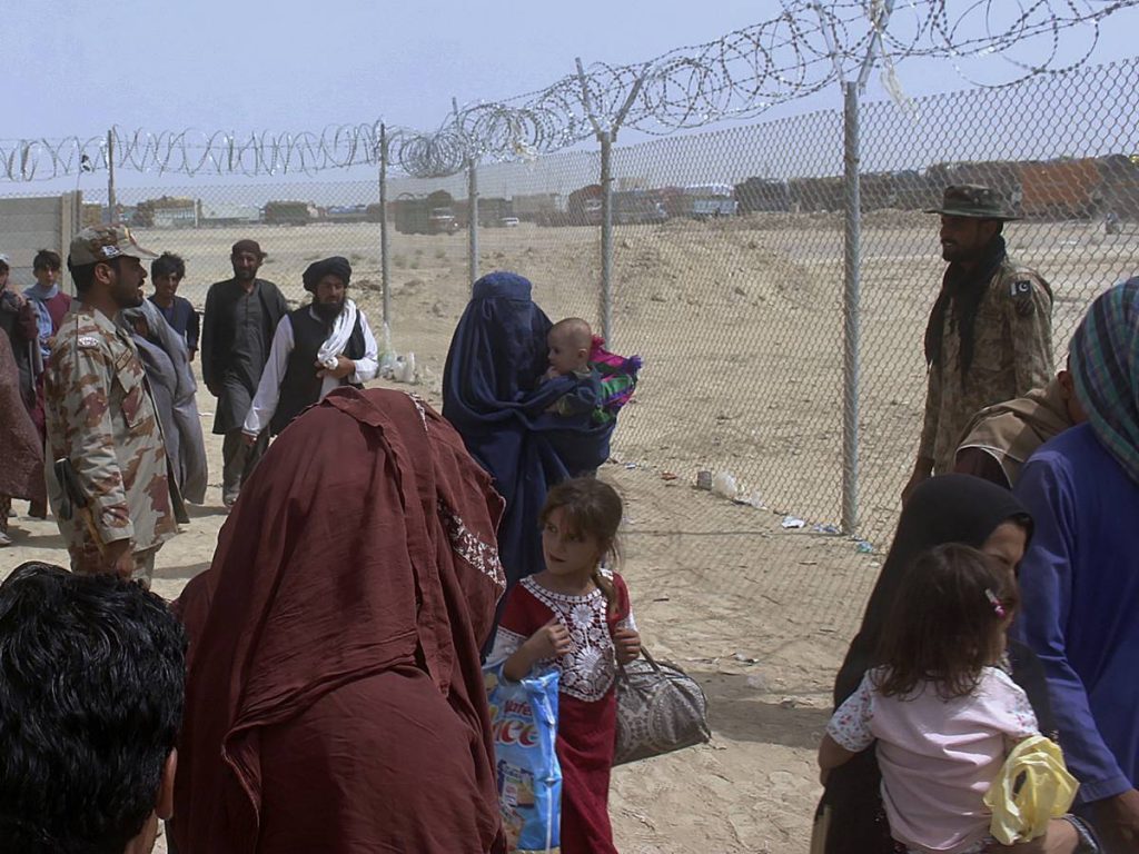 “Afghans welcome” and “No to thousands of arrivals.”  struggle over refugees