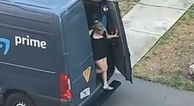 A half-naked woman gets out of the truck.  The driver is evicted on video