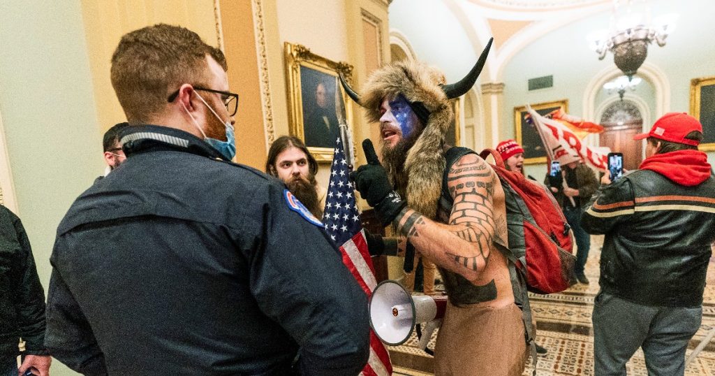 Assault on US Congressman 'shaman' Jake Angeli sentenced to 41 months in prison: 'Face of rebellion stirred up crowd'