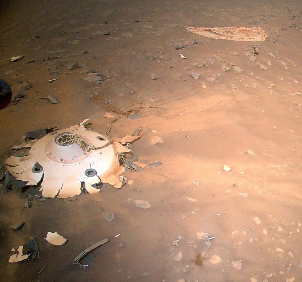 Creativity depicts remnants of a heat shield and parachute on Mars