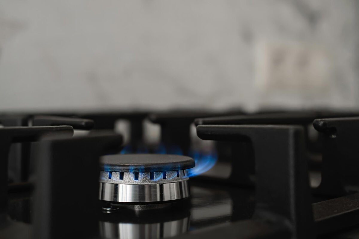 Stove-kitchen-modern-gas-natural-burning-with-blue-flame-home-gas consumption-close-up-selective focus